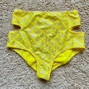 Metallic yellow cut out pole/rave shorts